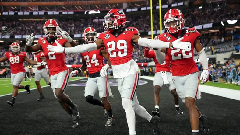 Jan 9, 2023; Inglewood, CA, USA; Georgia Bulldogs defensive back Christopher Smith (29) celebrates after defensive back Javon Bullard (22) made an interception against the TCU Horned Frogs during the second quarter of the CFP national championship game at SoFi Stadium. Mandatory Credit: Kirby Lee-USA TODAY Sports