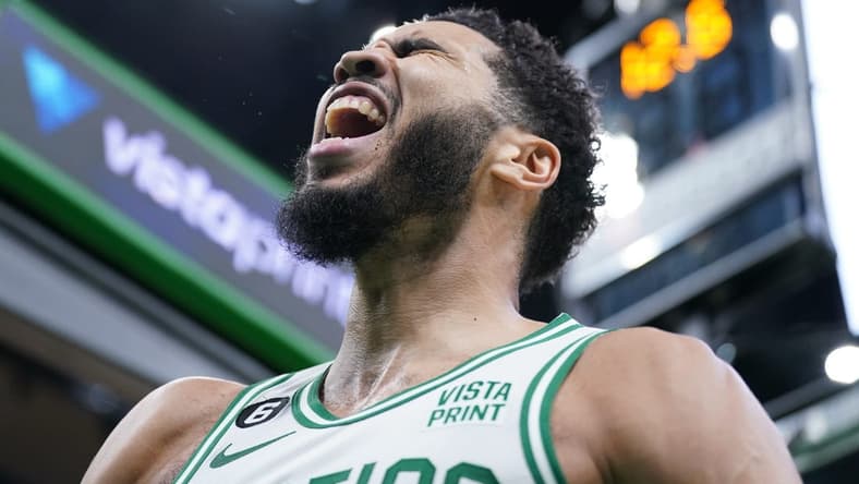 Jan 9, 2023; Boston, Massachusetts, USA; Boston Celtics forward Jayson Tatum (0) reacts after making a dunk in the last seconds of play against the Chicago Bulls in the second half at TD Garden. Mandatory Credit: David Butler II-USA TODAY Sports