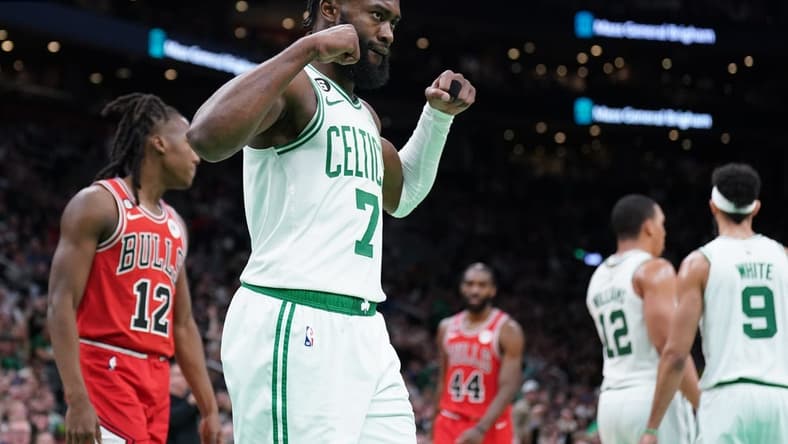 Jan 9, 2023; Boston, Massachusetts, USA; Boston Celtics guard Jaylen Brown (7) reacts after a basket by forward Grant Williams (12) against the Chicago Bulls in the second half at TD Garden. Mandatory Credit: David Butler II-USA TODAY Sports