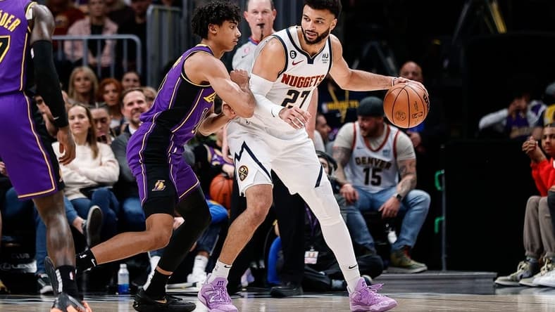 Jan 9, 2023; Denver, Colorado, USA; Denver Nuggets guard Jamal Murray (27) controls the ball as Los Angeles Lakers guard Max Christie (10) guards in the second quarter at Ball Arena. Mandatory Credit: Isaiah J. Downing-USA TODAY Sports