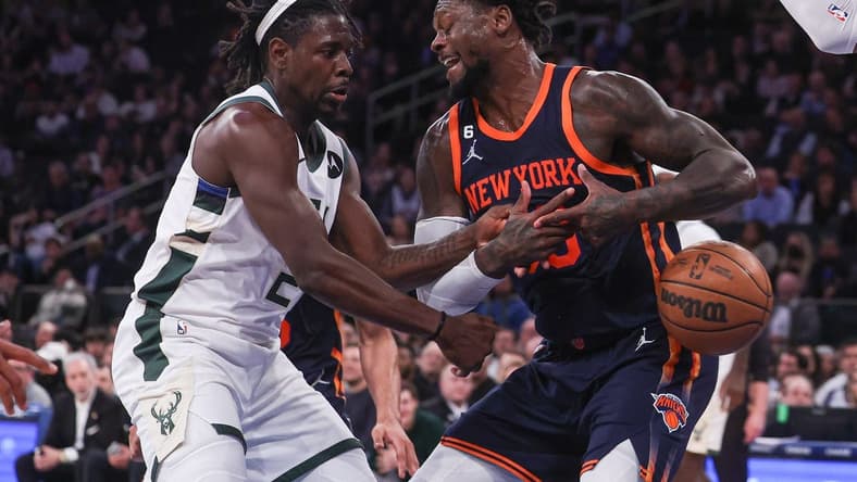Jan 9, 2023; New York, New York, USA; Milwaukee Bucks guard Jrue Holiday (21) knocks the ball away from New York Knicks forward Julius Randle (30) during the fourth quarter at Madison Square Garden. Mandatory Credit: Vincent Carchietta-USA TODAY Sports