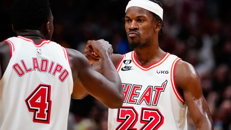 Jan 10, 2023; Miami, Florida, USA; Miami Heat forward Jimmy Butler (22) celebrates with guard Victor Oladipo (4) after scoring against the Oklahoma City Thunder during the fourth quarter at FTX Arena. Mandatory Credit: Rich Storry-USA TODAY Sports