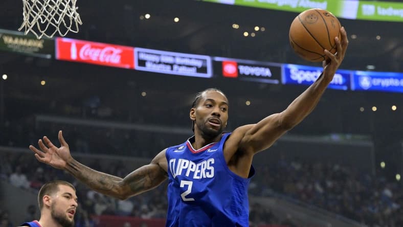 Jan 10, 2023; Los Angeles, California, USA;  Los Angeles Clippers forward Kawhi Leonard (2) reaches for a rebound in the first half against the Dallas Mavericks at Crypto.com Arena. Mandatory Credit: Jayne Kamin-Oncea-USA TODAY Sports