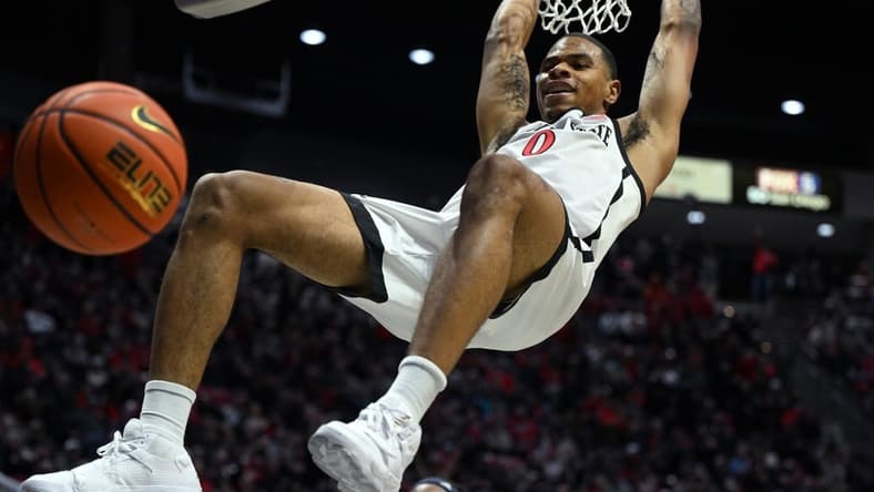 Jan 10, 2023; San Diego, California, USA; San Diego State Aztecs forward Keshad Johnson (0) dunks the ball during the first half against the Nevada Wolf Pack at Viejas Arena. Mandatory Credit: Orlando Ramirez-USA TODAY Sports