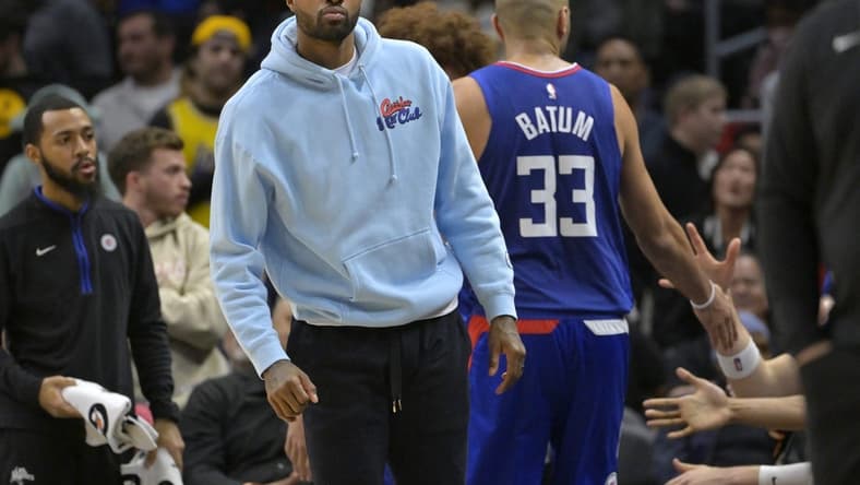 Jan 10, 2023; Los Angeles, California, USA;   Los Angeles Clippers guard Paul George (13) greets players as they come to the bench in the second half against the Dallas Mavericks at Crypto.com Arena. Mandatory Credit: Jayne Kamin-Oncea-USA TODAY Sports