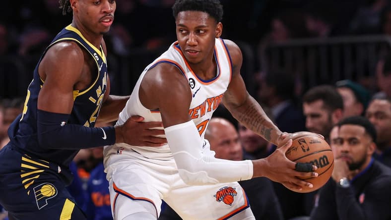 Jan 11, 2023; New York, New York, USA; New York Knicks guard RJ Barrett (9) shields the ball from Indiana Pacers guard Buddy Hield (24) during the second quarter at Madison Square Garden. Mandatory Credit: Vincent Carchietta-USA TODAY Sports
