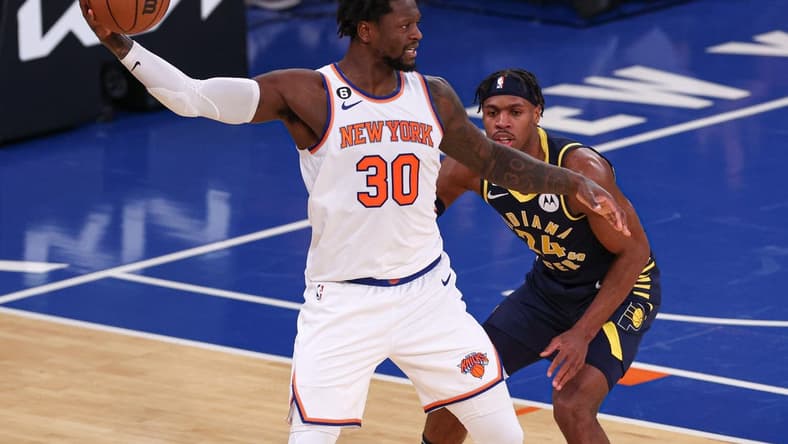 Jan 11, 2023; New York, New York, USA; New York Knicks forward Julius Randle (30) shields the ball from Indiana Pacers guard Buddy Hield (24) during the third quarter at Madison Square Garden. Mandatory Credit: Vincent Carchietta-USA TODAY Sports