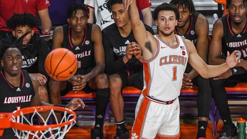 Jan 11, 2023; Clemson, South Carolina, USA; Clemson Tigers guard Chase Hunter (1) makes a three-point shot near the Louisville Cardinals bench during the first half at Littlejohn Coliseum. Mandatory Credit: Ken Ruinard-USA TODAY Sports