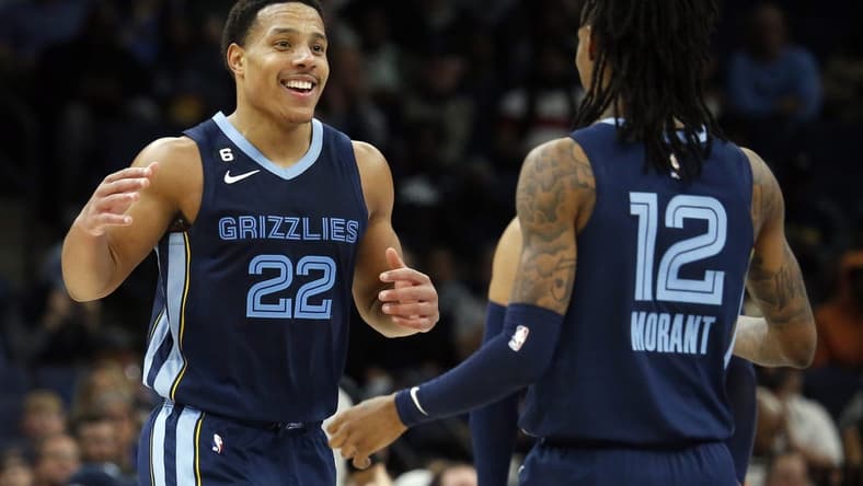 Jan 11, 2023; Memphis, Tennessee, USA; Memphis Grizzlies guard Desmond Bane (22) reacts with Memphis Grizzlies guard Ja Morant (12) after a basket during the second half against the San Antonio Spurs at FedExForum. Mandatory Credit: Petre Thomas-USA TODAY Sports