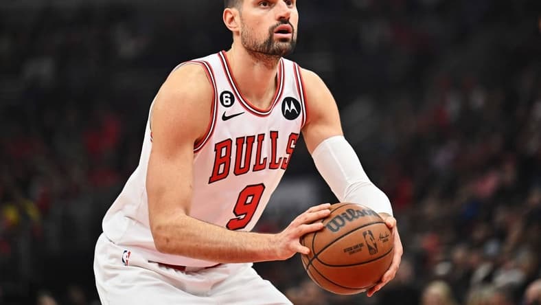 Jan 7, 2023; Chicago, Illinois, USA; Chicago Bulls center Nikola Vucevic (9) controls the ball against the Utah Jazz at United Center. Mandatory Credit: Jamie Sabau-USA TODAY Sports