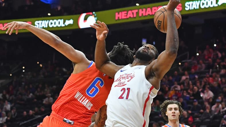 Jan 12, 2023; Philadelphia, Pennsylvania, USA; Oklahoma City Thunder forward Jaylin Williams (6) and Philadelphia 76ers center Joel Embiid (21) battle for the ball during the first quarter at Wells Fargo Center. Mandatory Credit: Eric Hartline-USA TODAY Sports