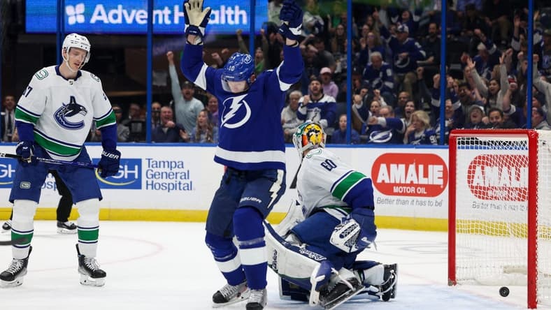 Jan 12, 2023; Tampa, Florida, USA; Tampa Bay Lightning right wing Corey Perry (10) scores a goal against the Vancouver Canucks in the first period at Amalie Arena. Mandatory Credit: Nathan Ray Seebeck-USA TODAY Sports