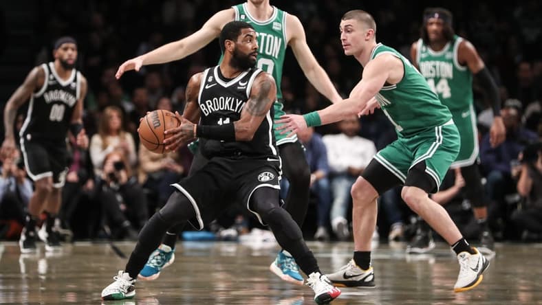 Jan 12, 2023; Brooklyn, New York, USA; Brooklyn Nets guard Kyrie Irving (11) is guarded by Boston Celtics guard Payton Pritchard (11) in the second quarter at Barclays Center. Mandatory Credit: Wendell Cruz-USA TODAY Sports