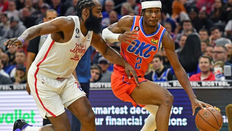 Jan 12, 2023; Philadelphia, Pennsylvania, USA; Oklahoma City Thunder guard Shai Gilgeous-Alexander (2) drives to the basket against Philadelphia 76ers guard James Harden (1) during the third quarter at Wells Fargo Center. Mandatory Credit: Eric Hartline-USA TODAY Sports