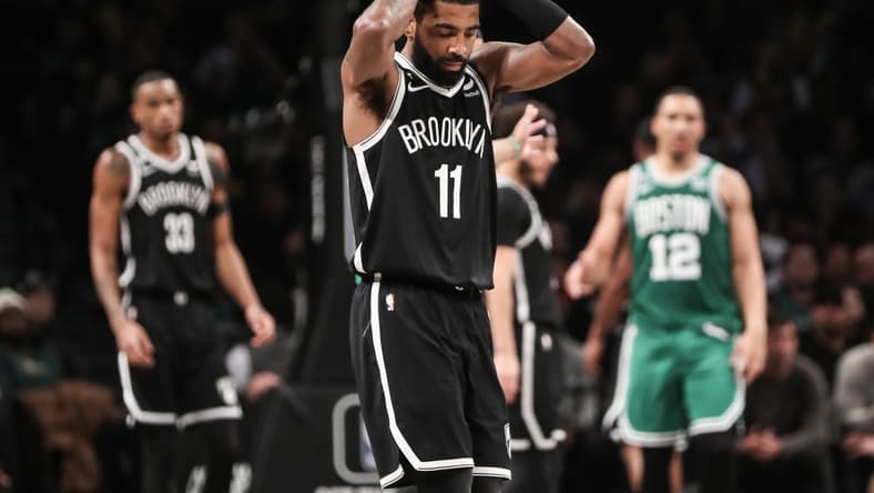 Jan 12, 2023; Brooklyn, New York, USA;  Brooklyn Nets guard Kyrie Irving (11) reacts after committing a foul in the fourth quarter against the Boston Celtics at Barclays Center. Mandatory Credit: Wendell Cruz-USA TODAY Sports