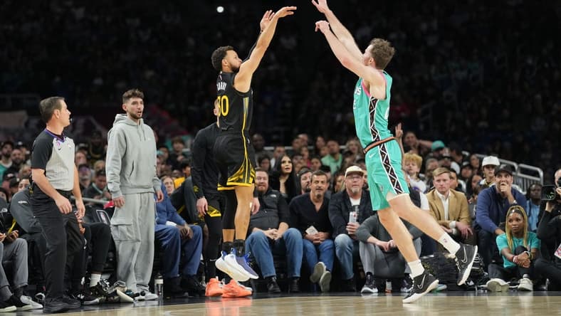 Jan 13, 2023; San Antonio, Texas, USA; Golden State Warriors guard Stephen Curry (30) shoots over San Antonio Spurs center Jakob Poeltl (25) in the first half at the Alamodome. Mandatory Credit: Daniel Dunn-USA TODAY Sports