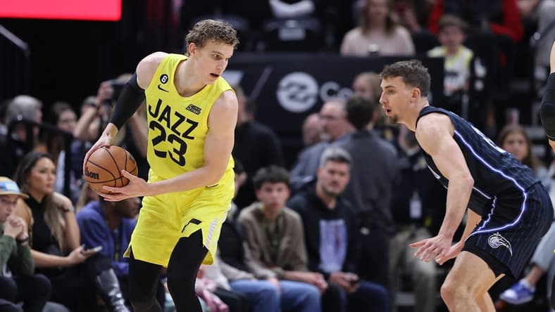 Jan 13, 2023; Salt Lake City, Utah, USA; Utah Jazz forward Lauri Markkanen (23) looks to move that ball against Orlando Magic forward Franz Wagner (22) in the first quarter at Vivint Arena. Mandatory Credit: Rob Gray-USA TODAY Sports