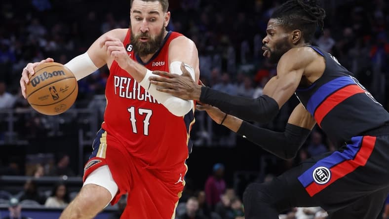 Jan 13, 2023; Detroit, Michigan, USA; New Orleans Pelicans center Jonas Valanciunas (17) dribbles on Detroit Pistons guard Nerlens Noel (9) in the second half at Little Caesars Arena. Mandatory Credit: Rick Osentoski-USA TODAY Sports