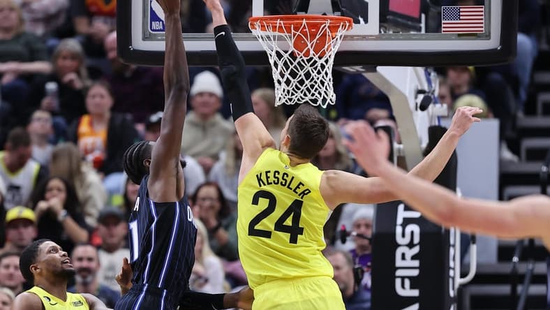 Jan 13, 2023; Salt Lake City, Utah, USA; Utah Jazz center Walker Kessler (24) blocks the shot of Orlando Magic center Mo Bamba (11) in the fourth quarter at Vivint Arena. Mandatory Credit: Rob Gray-USA TODAY Sports