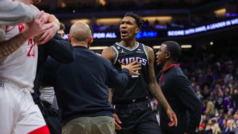 Jan 13, 2023; Sacramento, California, USA; Houston Rockets guard Garrison Mathews (25) is confronted by Sacramento Kings guard Malik Monk (0) during the fourth quarter at Golden 1 Center. Both players were ejected from the game. Mandatory Credit: Sergio Estrada-USA TODAY Sports