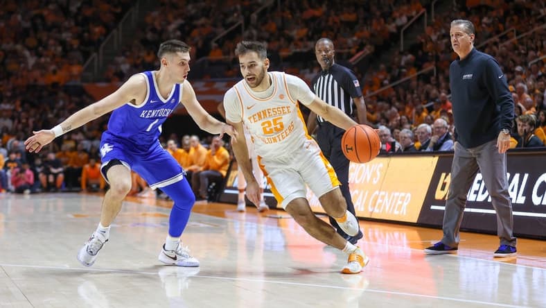 Jan 14, 2023; Knoxville, Tennessee, USA; Tennessee Volunteers guard Santiago Vescovi (25) moves the ball against Kentucky Wildcats guard CJ Fredrick (1) during the first half at Thompson-Boling Arena. Mandatory Credit: Randy Sartin-USA TODAY Sports