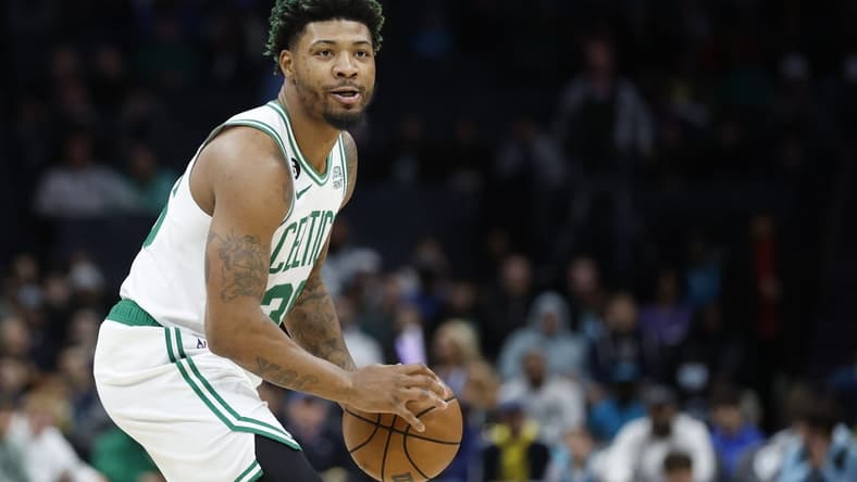 Jan 14, 2023; Charlotte, North Carolina, USA; Boston Celtics guard Marcus Smart (36) looks to pass against the Charlotte Hornets during the first half at Spectrum Center. The Boston Celtics won 122-106. Mandatory Credit: Nell Redmond-USA TODAY Sports