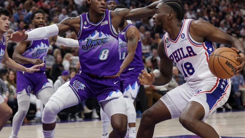 Jan 14, 2023; Salt Lake City, Utah, USA; Philadelphia 76ers guard Shake Milton (18) keeps the ball away from Utah Jazz forward Jarred Vanderbilt (8) during the second quarter at Vivint Arena. Mandatory Credit: Chris Nicoll-USA TODAY Sports