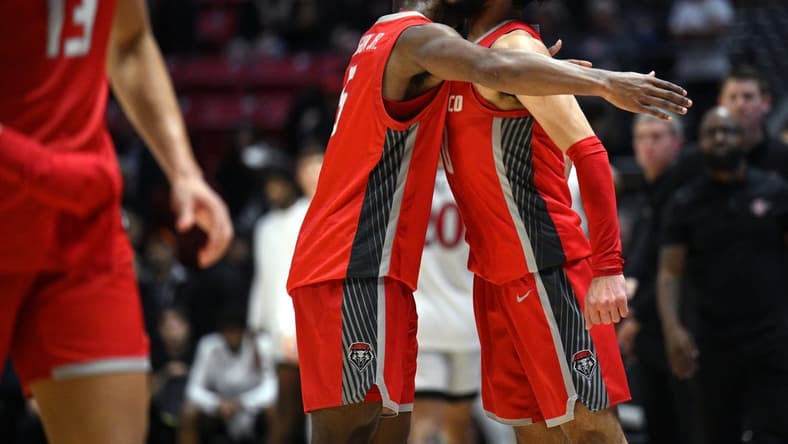 Jan 14, 2023; San Diego, California, USA; New Mexico Lobos guard Jaelen House (10) celebrates with guard Jamal Mashburn Jr. (5) after defeating the San Diego State Aztecs at Viejas Arena. Mandatory Credit: Orlando Ramirez-USA TODAY Sports