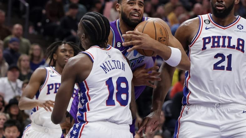 Jan 14, 2023; Salt Lake City, Utah, USA; Utah Jazz guard Talen Horton-Tucker (0) tries to get past Philadelphia 76ers guard Shake Milton (18) and to the basket during the second half at Vivint Arena. Mandatory Credit: Chris Nicoll-USA TODAY Sports
