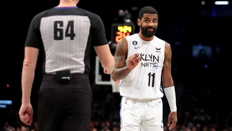 Jan 15, 2023; Brooklyn, New York, USA; Brooklyn Nets guard Kyrie Irving (11) gestures at referee Justin Van Duyne (64) during the third quarter against the Oklahoma City Thunder at Barclays Center. Mandatory Credit: Brad Penner-USA TODAY Sports
