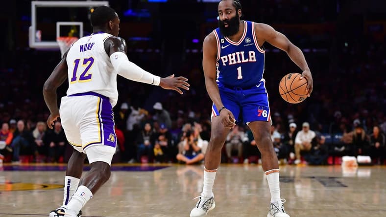 Jan 15, 2023; Los Angeles, California, USA; Philadelphia 76ers guard James Harden (1) controls the ball against Los Angeles Lakers guard Kendrick Nunn (12) during the first half at Crypto.com Arena. Mandatory Credit: Gary A. Vasquez-USA TODAY Sports