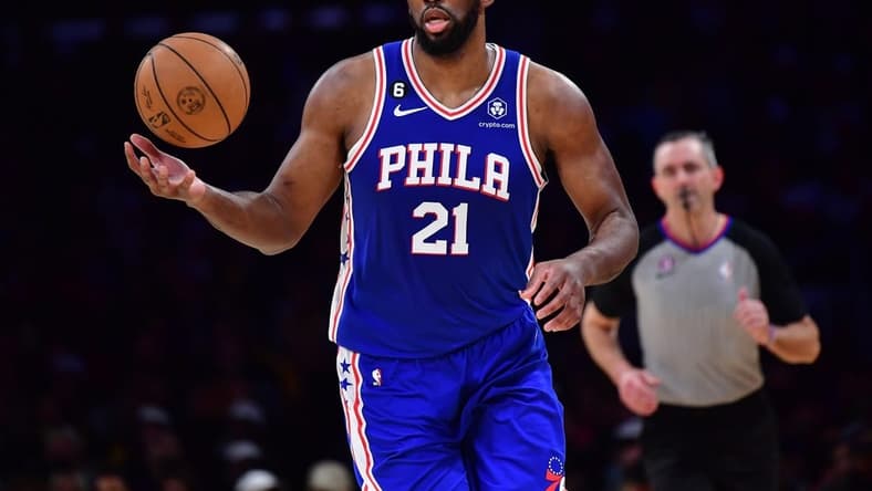 Jan 15, 2023; Los Angeles, California, USA; Philadelphia 76ers center Joel Embiid (21) brings the ball up court against the Los Angeles Lakers during the first half at Crypto.com Arena. Mandatory Credit: Gary A. Vasquez-USA TODAY Sports