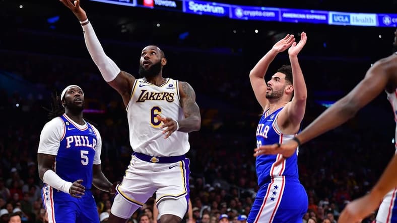 Jan 15, 2023; Los Angeles, California, USA; Los Angeles Lakers forward LeBron James (6) moves to the basket ahead of Philadelphia 76ers forward Georges Niang (20) during the second half at Crypto.com Arena. Mandatory Credit: Gary A. Vasquez-USA TODAY Sports