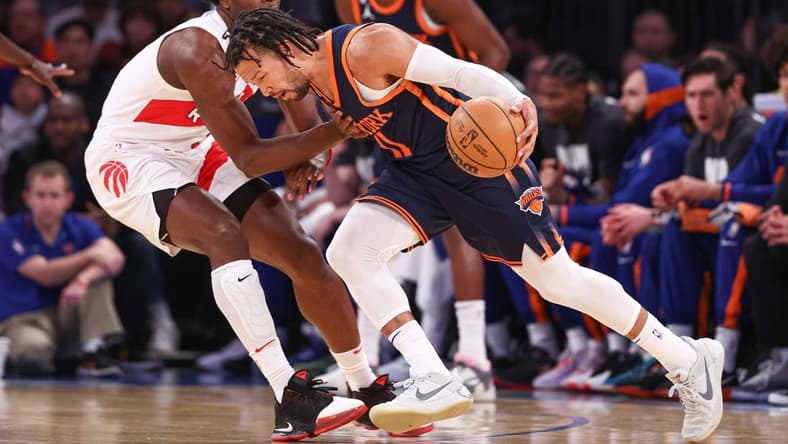 Jan 16, 2023; New York, New York, USA; New York Knicks guard Jalen Brunson (11) dribbles against Toronto Raptors forward O.G. Anunoby (3) during the first quarter at Madison Square Garden. Mandatory Credit: Vincent Carchietta-USA TODAY Sports
