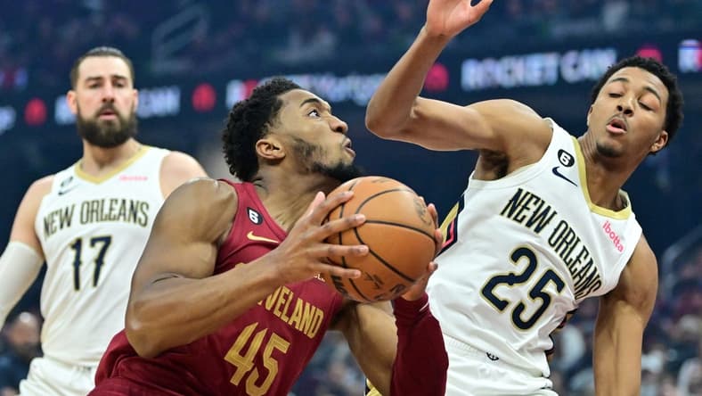 Jan 16, 2023; Cleveland, Ohio, USA; Cleveland Cavaliers guard Donovan Mitchell (45) drives to the basket against New Orleans Pelicans guard Trey Murphy III (25) at Rocket Mortgage FieldHouse. Mandatory Credit: Ken Blaze-USA TODAY Sports