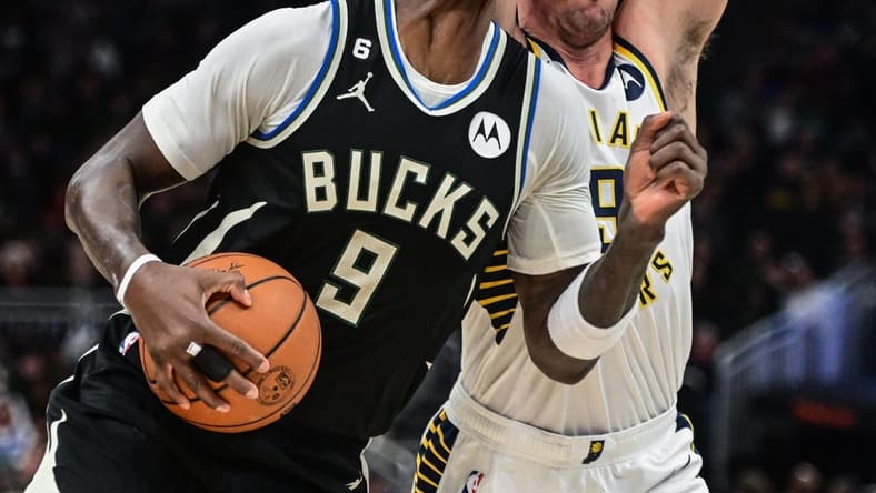Jan 16, 2023; Milwaukee, Wisconsin, USA; Milwaukee Bucks forward Bobby Portis (9) drives for the basket against Indiana Pacers guard T.J. McConnell (9) in the second quarter at Fiserv Forum. Mandatory Credit: Benny Sieu-USA TODAY Sports