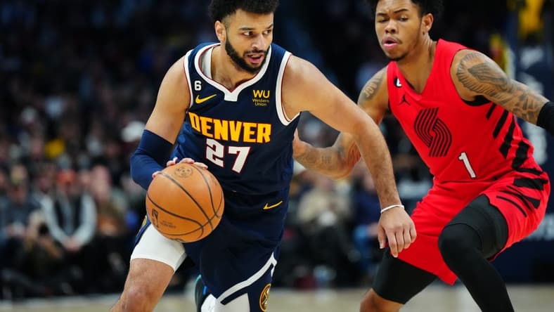 Jan 17, 2023; Denver, Colorado, USA; Denver Nuggets guard Jamal Murray (27) dribbles past Portland Trail Blazers guard Anfernee Simons (1) in the first quarter at Ball Arena. Mandatory Credit: Ron Chenoy-USA TODAY Sports