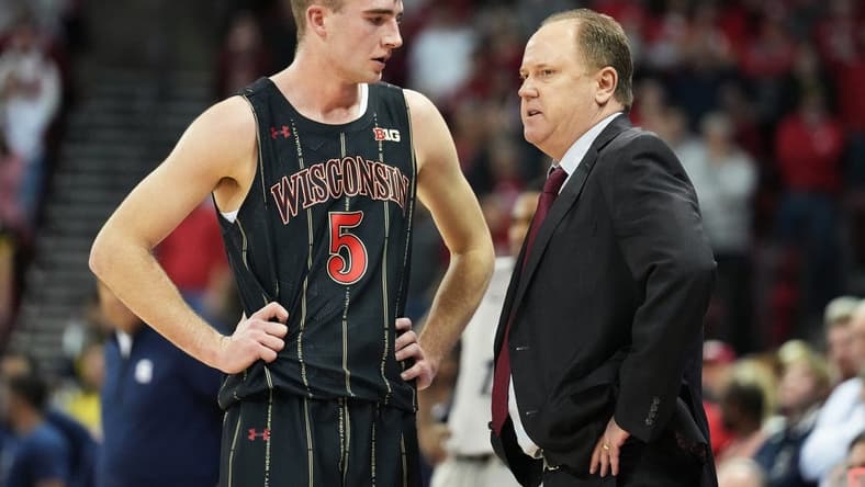 Jan 17, 2023; Madison, Wisconsin, USA;  Wisconsin Badgers forward Tyler Wahl (5) talks with Wisconsin Badgers head coach Greg Gard during the second half against the Penn State Nittany Lions at the Kohl Center. Mandatory Credit: Kayla Wolf-USA TODAY Sports