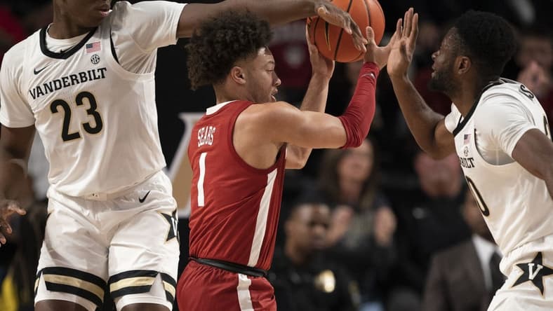 Jan 17, 2023; Nashville, Tennessee, USA; Alabama guard Mark Sears (1) tries to get past Vanderbilt forward Malik Dia (23) and forward Emmanuel Ansong (20) during the first half at Memorial Gymnasium. Mandatory Credit: George Walker IV-USA TODAY Sports