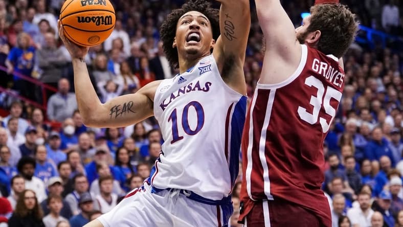 Jan 10, 2023; Lawrence, Kansas, USA; Kansas Jayhawks forward Jalen Wilson (10) shoots against Oklahoma Sooners forward Tanner Groves (35) during the second half at Allen Fieldhouse. Mandatory Credit: Jay Biggerstaff-USA TODAY Sports