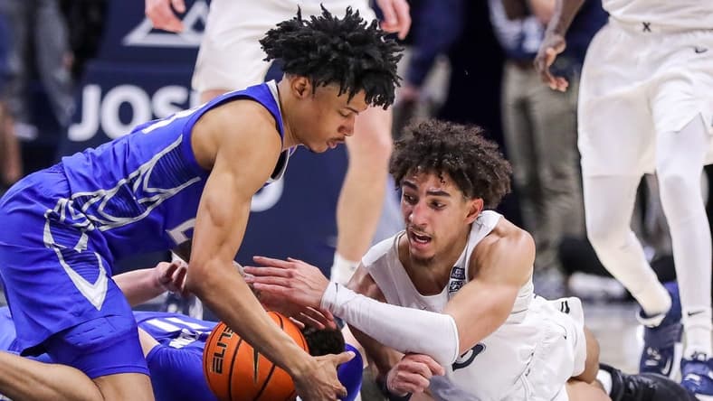 Jan 11, 2023; Cincinnati, Ohio, USA; Creighton Bluejays guard Trey Alexander (23) battles for the ball against Xavier Musketeers guard Colby Jones (3) in the second half at Cintas Center. Mandatory Credit: Katie Stratman-USA TODAY Sports