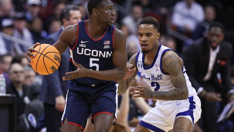 Jan 18, 2023; Newark, New Jersey, USA; Connecticut Huskies guard Hassan Diarra (5) dribbles as Seton Hall Pirates guard Al-Amir Dawes (2) defends during the second half at Prudential Center. Mandatory Credit: Vincent Carchietta-USA TODAY Sports