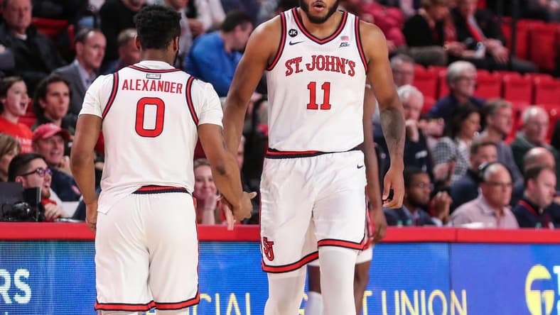 Jan 10, 2023; Queens, New York, USA; St. John's Red Storm guard Posh Alexander (0) and center Joel Soriano (11) at Carnesecca Arena. Mandatory Credit: Wendell Cruz-USA TODAY Sports