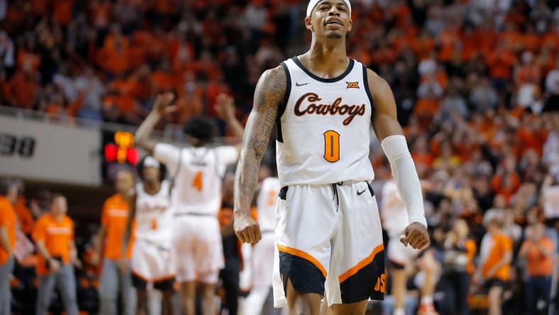 Oklahoma State Cowboys guard Avery Anderson III (0) celebrates during a men's Bedlam college basketball game between the Oklahoma State University Cowboys (OSU) and the University of Oklahoma Sooners (OU) at Gallagher-Iba Arena in Stillwater, Okla., Wednesday, Jan. 18, 2023. Oklahoma State won 72-56.

cover main