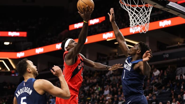 Jan 19, 2023; Minneapolis, Minnesota, USA; Toronto Raptors forward Pascal Siakam (43) shoots while Minnesota Timberwolves guard Anthony Edwards (1) defends during the first quarter at Target Center. Mandatory Credit: Matt Krohn-USA TODAY Sports