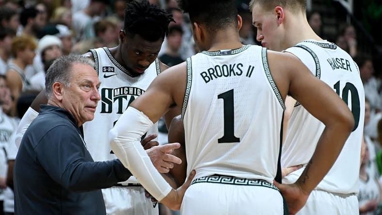 Jan 19, 2023; East Lansing, Michigan, USA; Michigan State Spartans head coach Tom Izzo huddles with his players in the first half against the Rutgers Scarlet Knights at Jack Breslin Student Events Center. Mandatory Credit: Dale Young-USA TODAY Sports