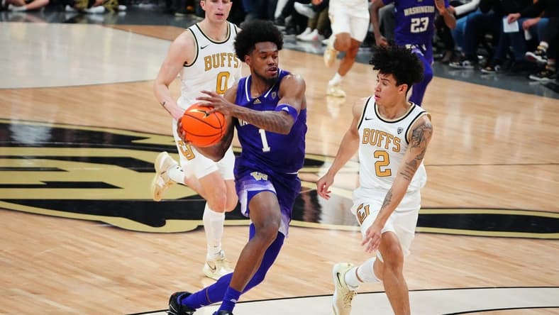 Jan 19, 2023; Boulder, Colorado, USA; Washington Huskies forward Keion Brooks (1) drives at Colorado Buffaloes guard KJ Simpson (2) in the first half at the CU Events Center. Mandatory Credit: Ron Chenoy-USA TODAY Sports