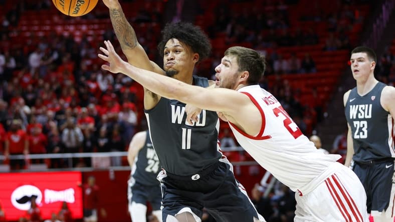 Jan 19, 2023; Salt Lake City, Utah, USA; Washington State Cougars forward DJ Rodman (11) and Utah Utes guard Rollie Worster (25) battle in the first half at Jon M. Huntsman Center. Mandatory Credit: Jeffrey Swinger-USA TODAY Sports