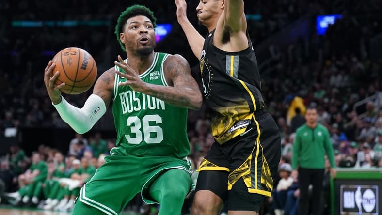 Jan 19, 2023; Boston, Massachusetts, USA; Boston Celtics guard Marcus Smart (36) drives the ball against Golden State Warriors guard Jordan Poole (3) in the second half at TD Garden. Mandatory Credit: David Butler II-USA TODAY Sports