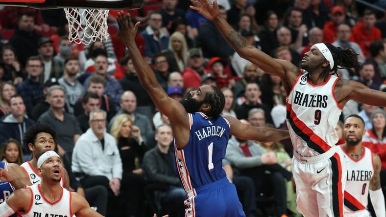 Jan 19, 2023; Portland, Oregon, USA; Philadelphia 76ers guard James Harden (1) shoots the ball over Portland Trail Blazers forward Jerami Grant (9) in the first half at Moda Center. Mandatory Credit: Jaime Valdez-USA TODAY Sports